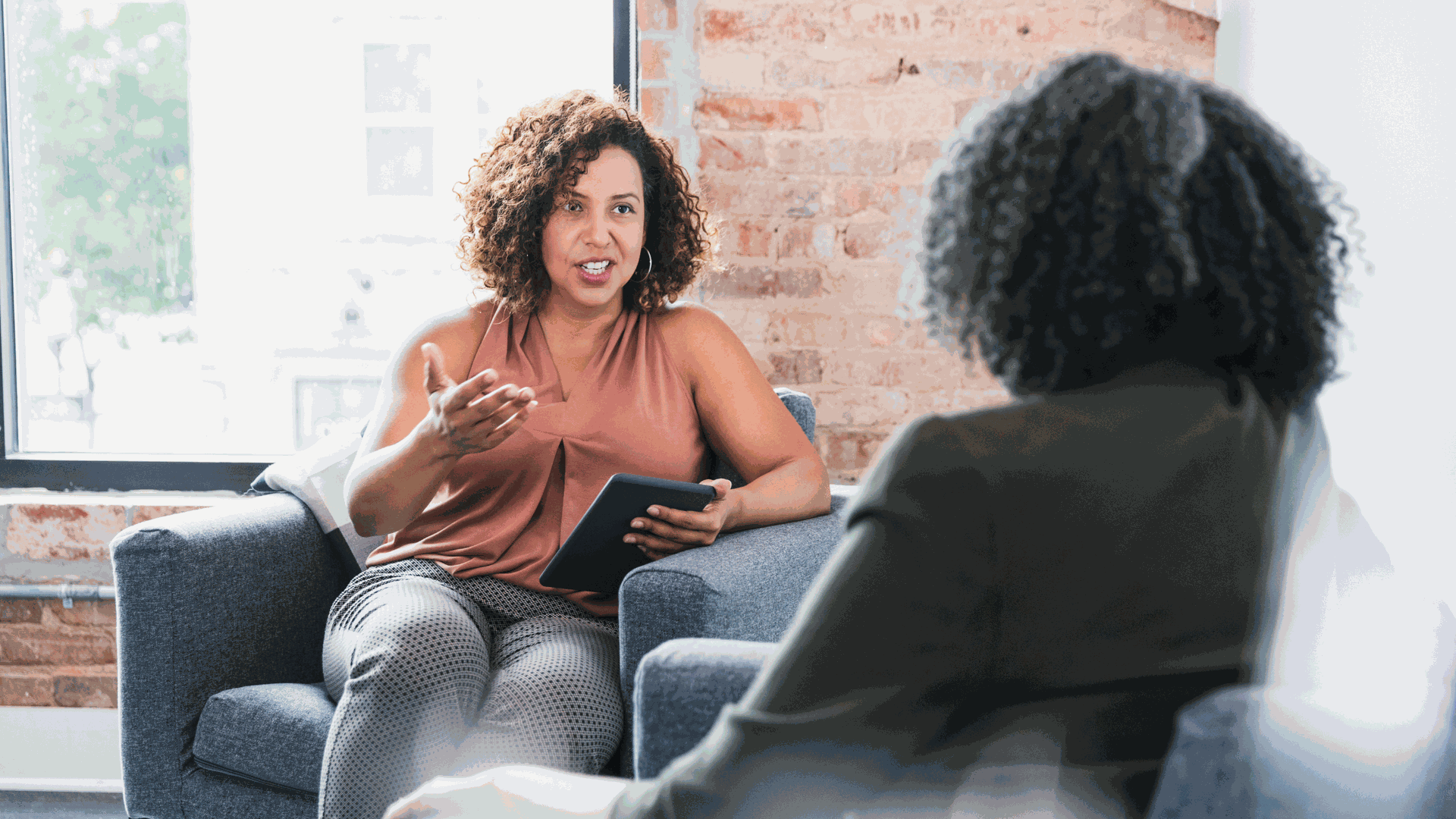 two women talking sitting